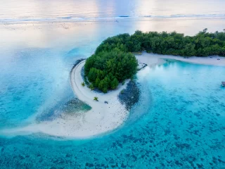 An aerial view of Muri Lagoon at sunrise on Rarotonga in the Cook Islands