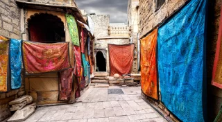 City street market with shops of Jaisalmer fort in Rajasthan, India