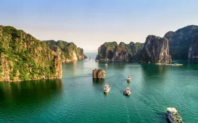 floating fishing village and rock island, Halong Bay, Vietnam, Southeast Asia. UNESCO World Heritage Site. Junk boat cruise to Ha Long Bay.